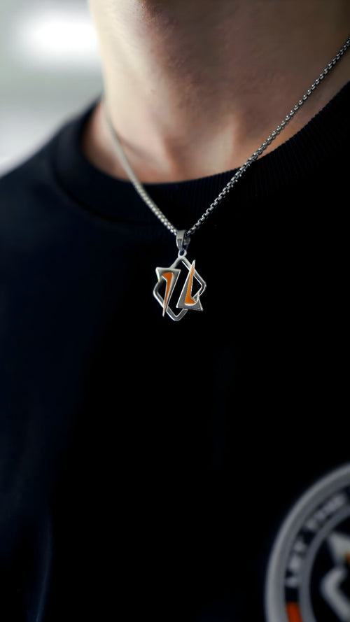 HMBLE necklace with the logo pendant, worn